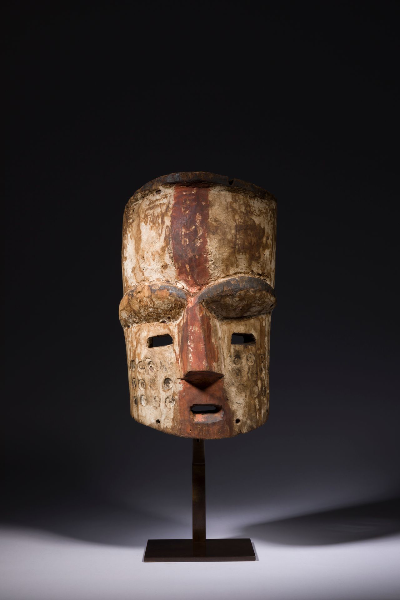 Null An important polychrome bwiti initiation mask, with large arches, a rounded&hellip;