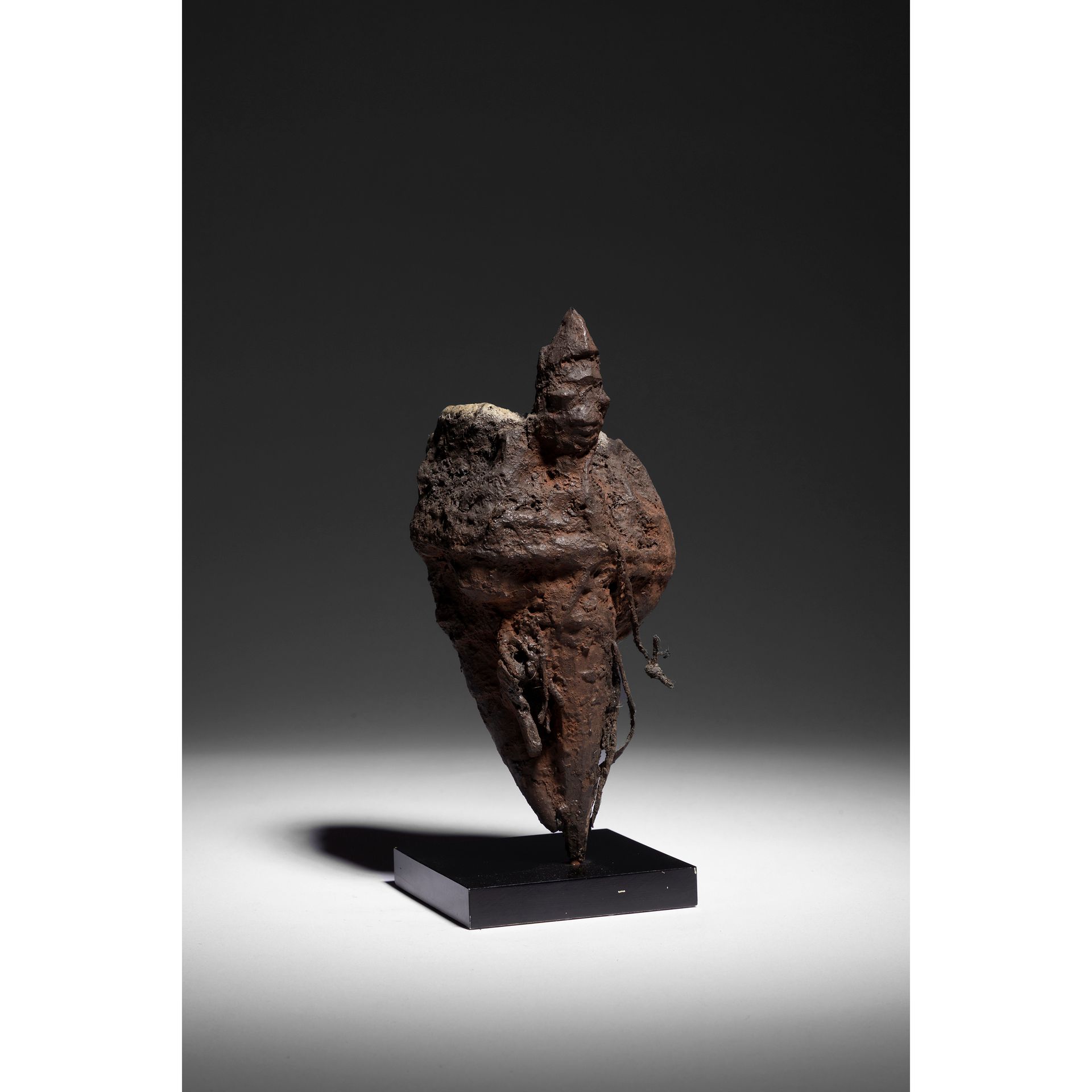 Null A voodoo statuette, bocio carved of a figure in a stake to which are tied o&hellip;