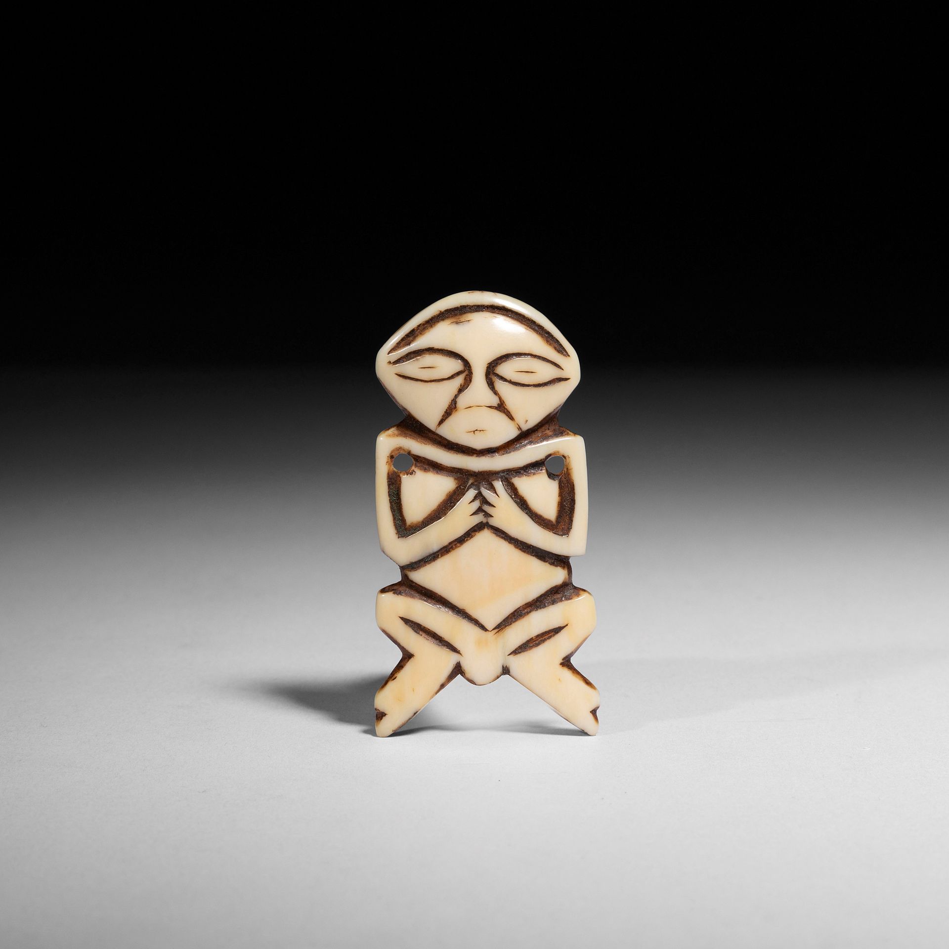 Null An ancient anthropomorphic pendant with a very rhythmic stylization of the &hellip;