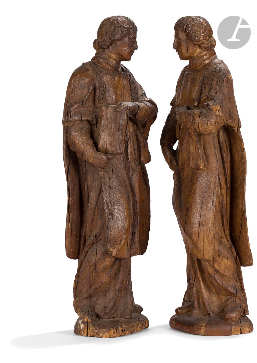 Null 两个橡木雕刻的执事圣徒，背部有粗糙的痕迹。
佛兰德斯或法国北部，16世纪下半叶
高：65.5厘米
(虫孔)