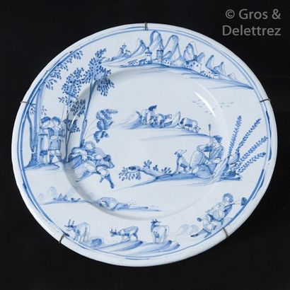 Round earthenware dish with shepherds' blue...