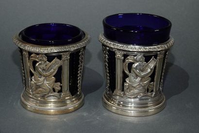 null Pair of openwork silver salerons with repelled decoration of musicians draped...