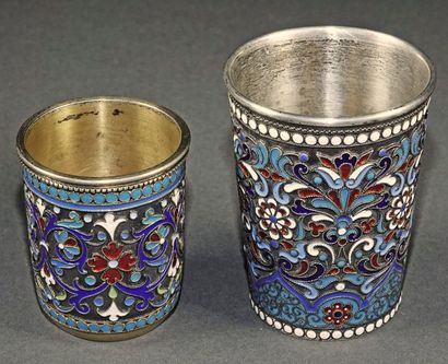 Two vodka cups in silver, vermeil and polychrome...