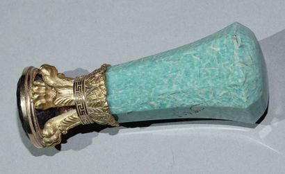 null Stamp, the handle with cut sides in turquoise (?) set in a yellow gold setting...