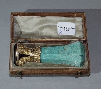 null Stamp, the handle with cut sides in turquoise (?) set in a yellow gold setting...