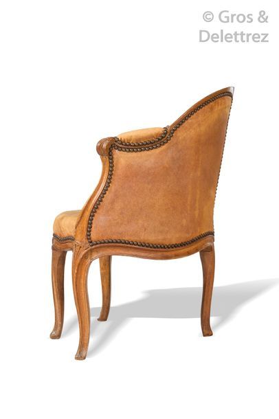 null Office armchair in natural wood molded and carved with leather. Louis XV period....