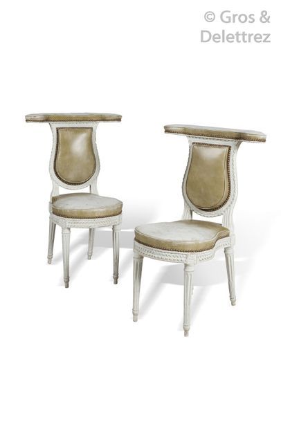Pair of voyeuristic chairs in white molded...