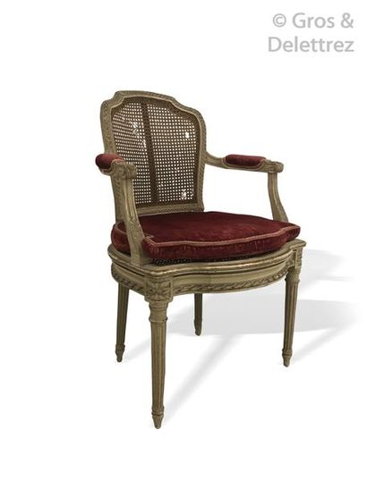 null Pair of grey caned wooden rechampis armchairs decorated with carved piastres...