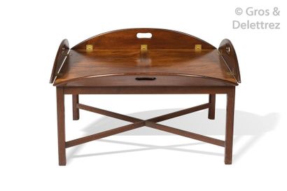 null Solid mahogany oval boat table with four folding flaps, brass hinges, the base...