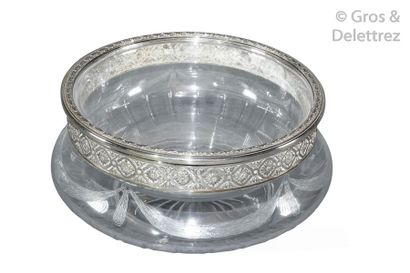 null Crystal bowl to be refreshed with two elements encircled by chased silver in...