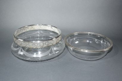 null Crystal bowl to be refreshed with two elements encircled by chased silver in...