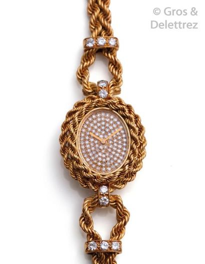 BOUCHERON Lady's yellow gold watch strap, oval case, dial paved with brilliant-cut...