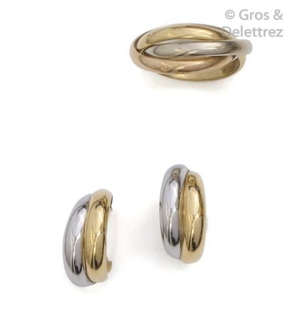 null Set consisting of a ring and a pair of gold earrings in three colors. Tower...