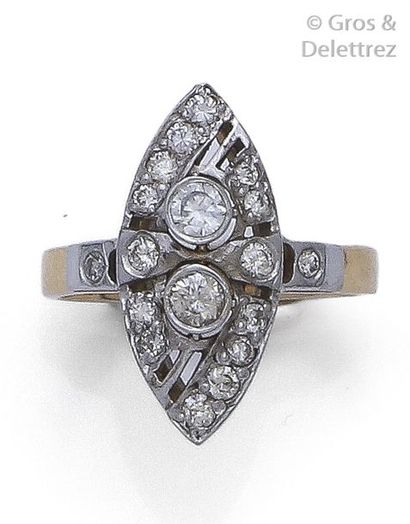 null Ring in 14K yellow gold and silver, adorned with two brilliantly cut diamonds...
