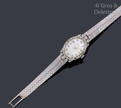 LUXE Bracelet-montre de dame en or gris, composé d’un boîtier ovale, cadran argent...