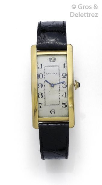 CARTIER " Tank American Curvex " - Yellow gold wrist watch, white dial with Arabic...