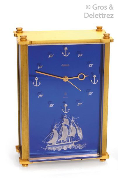 JAEGER Alarm clock in gilded brass, the night blue dial with engraved glass decorated...