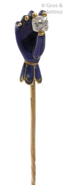 null Charming yellow gold tie pin, adorned with an enamelled hand holding a cushion...