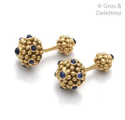 CARTIER Pair of pearl yellow gold cufflinks, each adorned with cabochon sapphires....