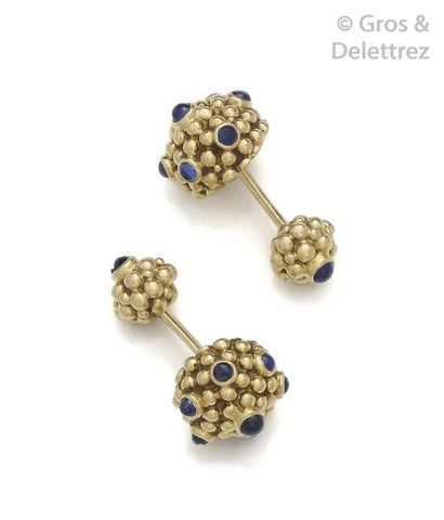 CARTIER Pair of pearl yellow gold cufflinks, each adorned with cabochon sapphires....