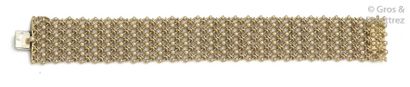 CARTIER Soft yellow gold bracelet with chiselled fishnet links and linked by yellow...