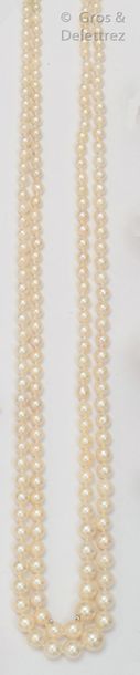 null Necklace composed of two rows of falling cultured pearls. Yellow gold ratchet...