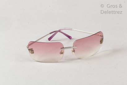 CHANEL *Pair of sunglasses " Camélia " in silver metal, smoked lenses in pink gradient....