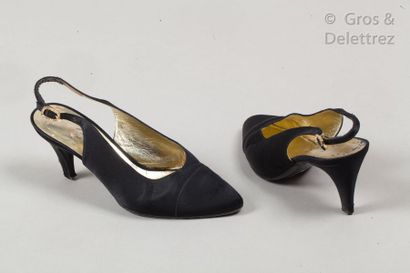 CHANEL *Pair of black satin evening slingbacks, 75mm covered heels, leather soles....