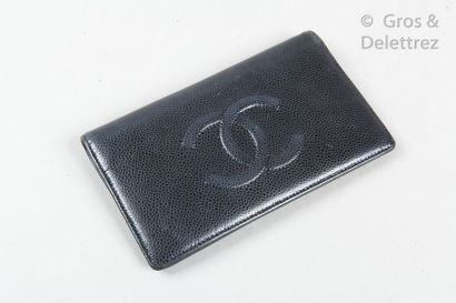 CHANEL Circa 2009 *Black caviar calfskin wallet, stitched with the House logo, inside...