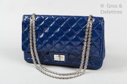 CHANEL Circa 2010

*Bag " 2.55 Reissue Jumbo " 30cm in navy aged patent leather,...