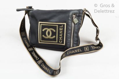CHANEL Circa 2005 23cm black canvas bag decorated with an important patch with the...