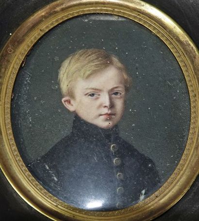 null Two oval miniatures depicting a young boy in a black jacket with buttons and...