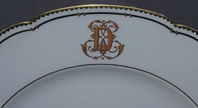 null Important part of a table service in poly-lobed white porcelain edged with gold...