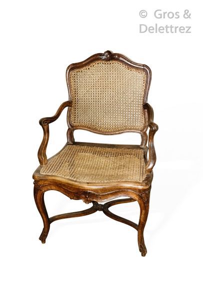 null Caned armchair with flat back in natural wood molded and carved with two leaf...