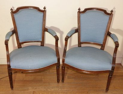 null Pair of cabriolet armchairs in walnut moulded and carved with flowers, the backrests...