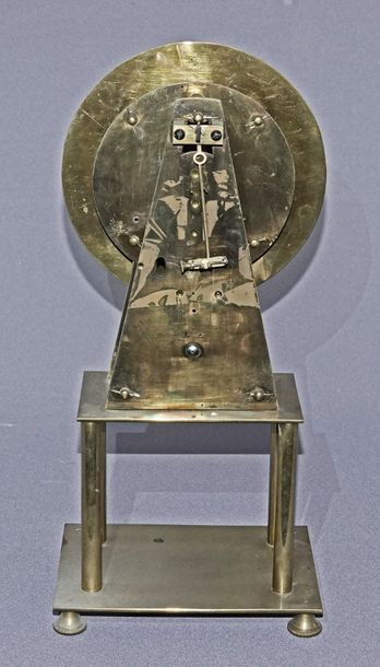 null Half-skeleton clock in the shape of a pyramid in brass, the enamelled dial signed...