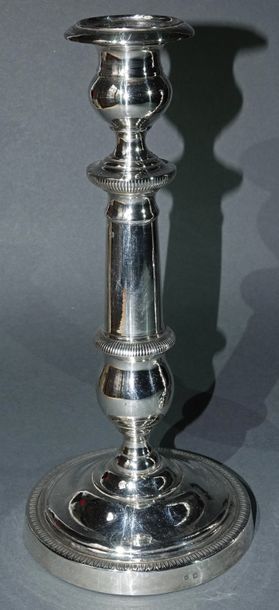 null Pair of candlesticks in plain re-silvered metal with gadroon moulding decoration....