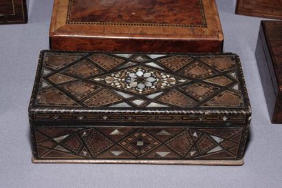 null Box set meeting comprenant :

A Syrian wooden box inlaid with mother-of-pearl...