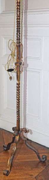 null Tripod floor lamp in gilded and patinated wrought iron with arabesque decoration,...