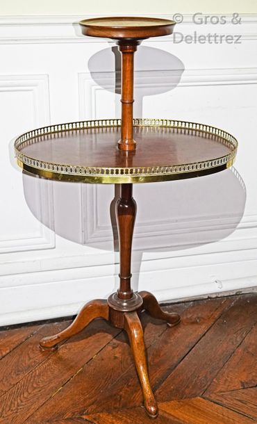 null Small mahogany serving table with two oval tops, the lower one surrounded by...