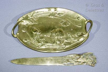null Brass Art-Nouveau pocket-emptyer decorated in bas-relief with a woman and flowered...