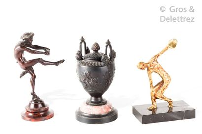 null Set of three antique bronzes representing a discobole, a flute player and a...