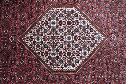 null Oriental carpet with polychrome floral decoration on a red background (slight...