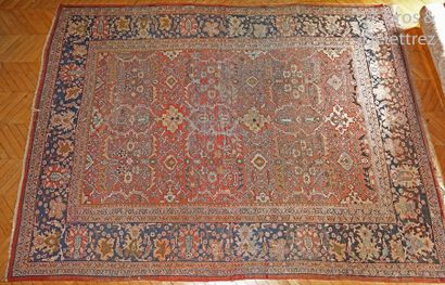 null Important carpet with stylized polychrome floral decoration on a coral background,...