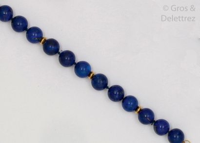 null Bracelet of lapis lazuli beads alternating with yellow gold ferrules. Yellow...