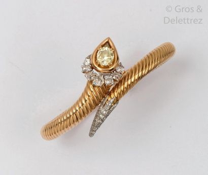 MAUBOUSSIN Bracelet " Serpent " rigid bracelet opening in gadrooned yellow gold,...