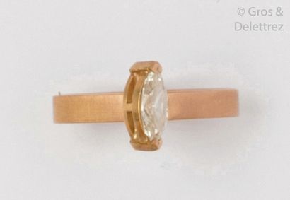 null Amati yellow gold artist's ring set with a shuttle diamond weighing 0.58 carat....