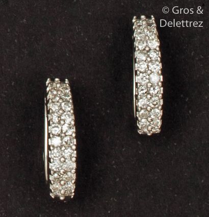 null Pair of white gold earrings, each adorned with two lines of brilliant-cut diamonds....
