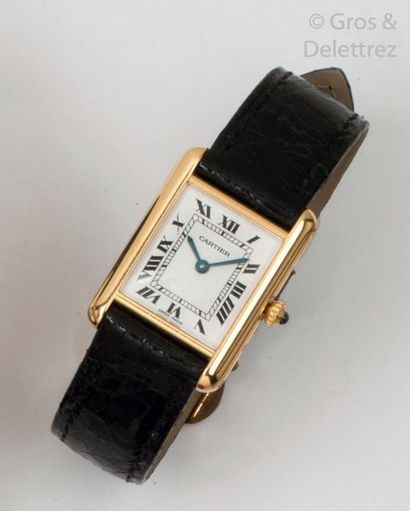 CARTIER " Tank " - Ladies' watch in yellow gold, rectangular case, white dial with...