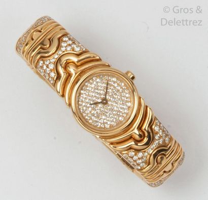 BULGARI 

" Parentesi " - Ladies' watchband in yellow gold, round case, the dial...